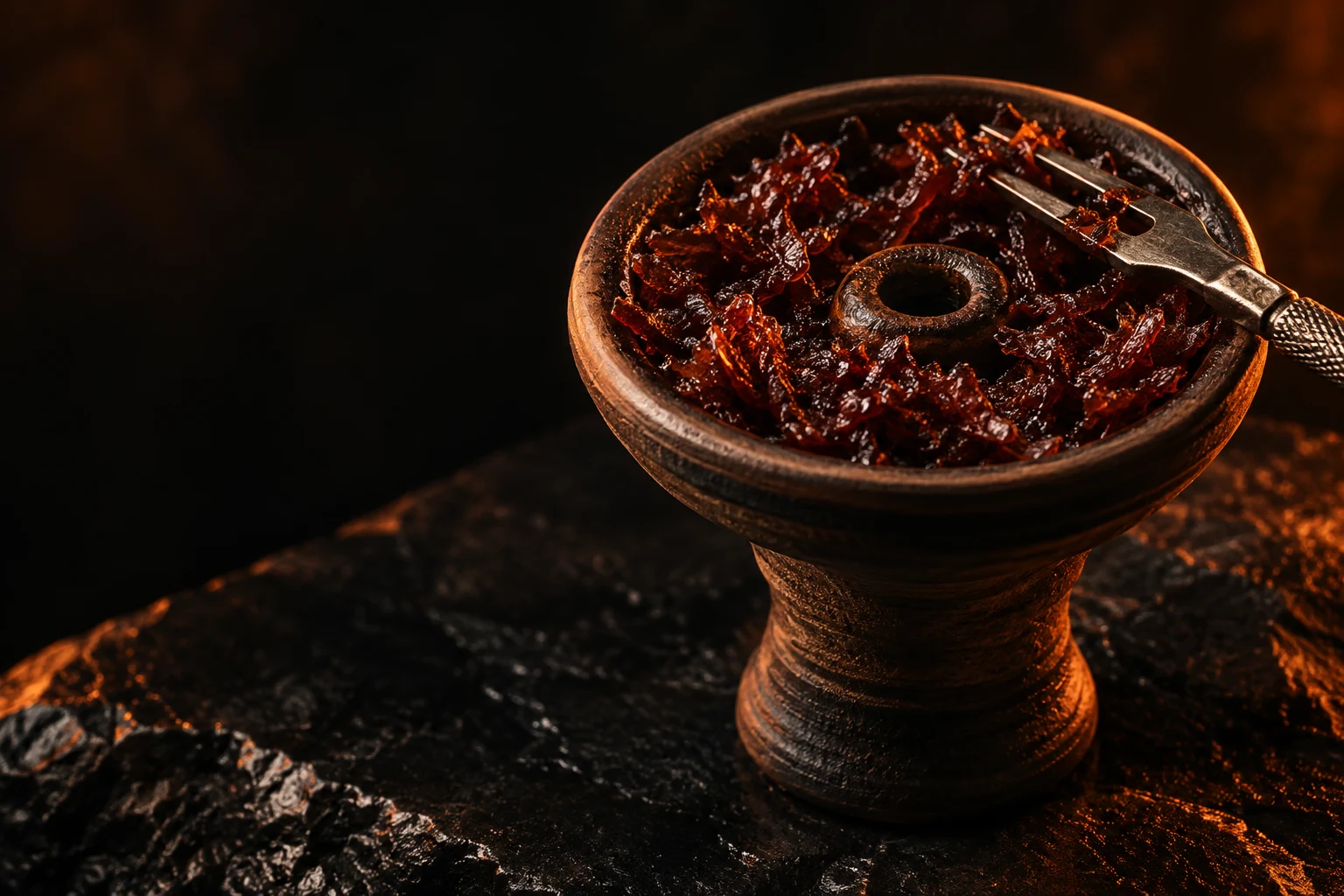 Shisha tobacco packed in a clay bowl